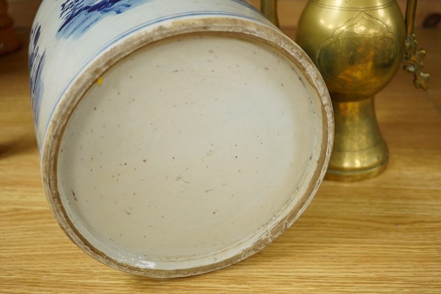 A Chinese cylindrical blue and white brush pot and a brass ewer, largest 39cm high. Condition - fair